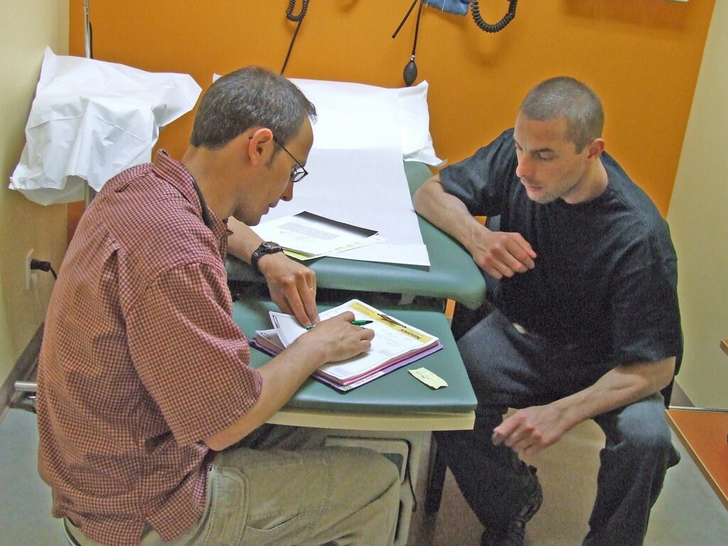 Doctor and patient going over paperwork