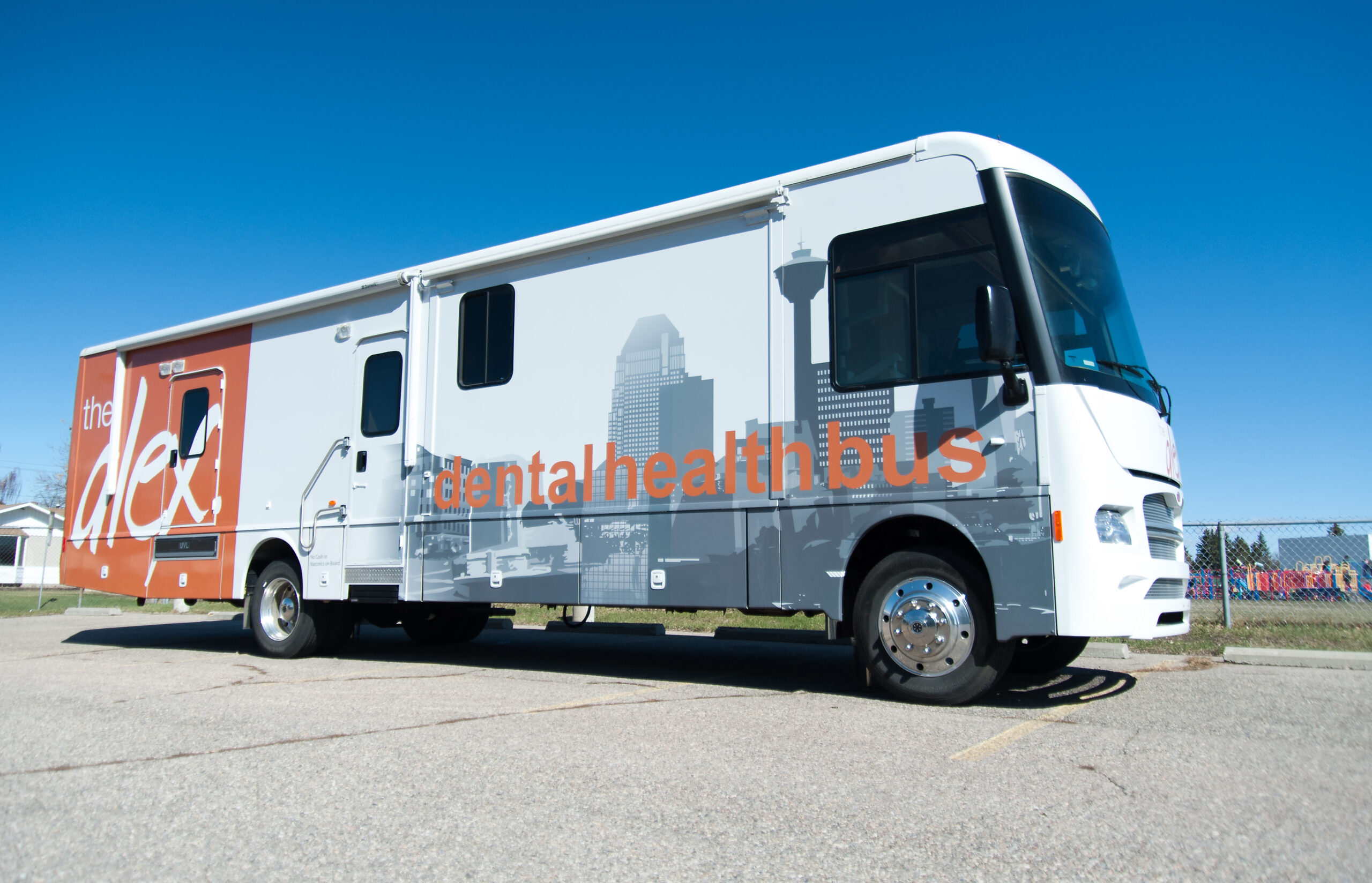 A side-profile photo of The Alex Dental Health Bus