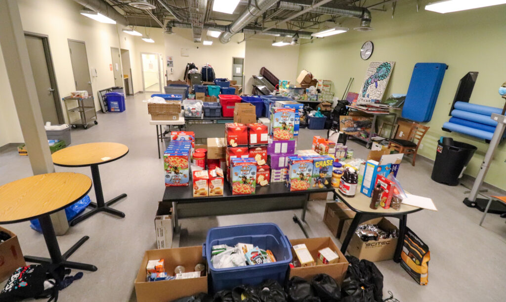Room with tables full of donations