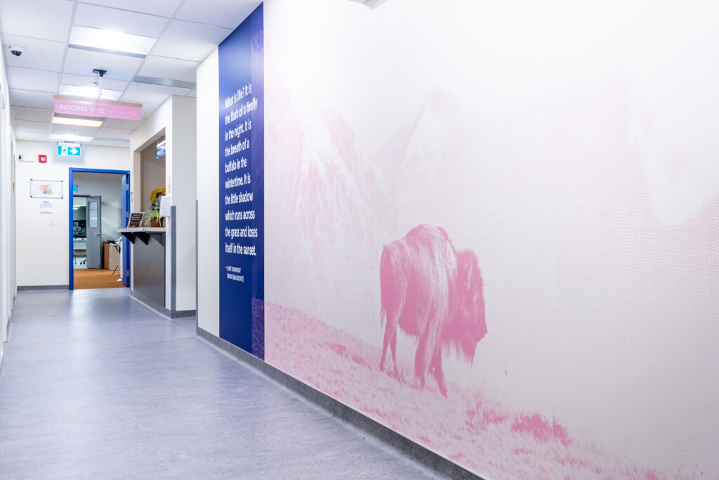 A hallway at The Alex with buffalo mural